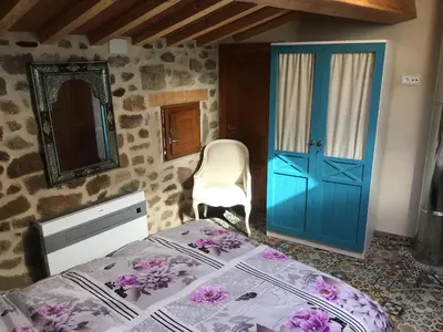 Cama o camas de una habitación en Apartamentos A Fala en Trevejo y San Martin de Trevejo, Sierra de Gata
