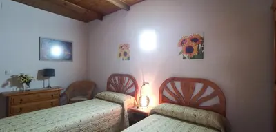 Cama o camas de una habitación en Casa Rural Casona de Jerte