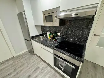 Una cocina o zona de cocina en DAU Centro