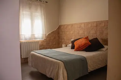 Cama o camas de una habitación en Apartamentos Turísticos Domus Aquae