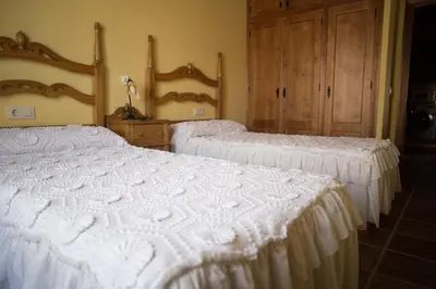 Cama o camas de una habitación en Apartamentos Rurales Arco de Trajano