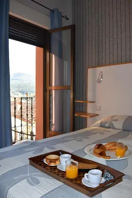 Cama o camas de una habitación en Hostal Altamira Guadalupe
