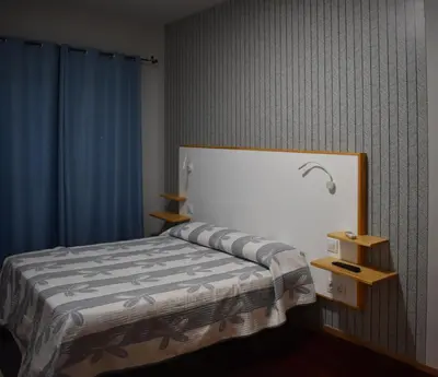 Cama o camas de una habitación en Hostal Altamira Guadalupe