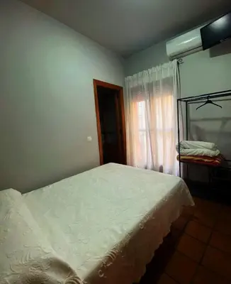Cama o camas de una habitación en Hostal Altamira Guadalupe