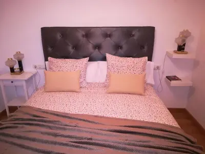Cama o camas de una habitación en Alojamiento en Villanueva Serena 2 dormitorios