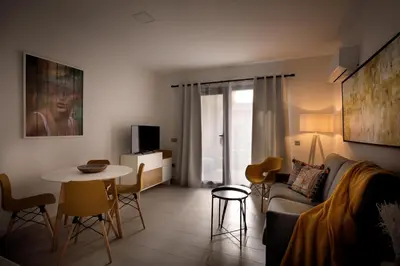 Una televisión o centro de entretenimiento en Apartamentos Turísticos Huerto El Horno