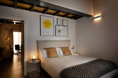 Cama o camas de una habitación en Apartamentos Turísticos Huerto El Horno