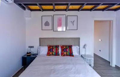 Cama o camas de una habitación en Apartamentos Turísticos Huerto El Horno
