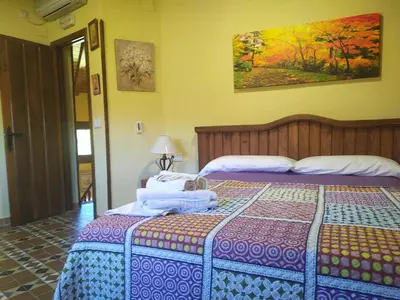 Cama o camas de una habitación en Complejo Rural Los Chozos Valle del Jerte