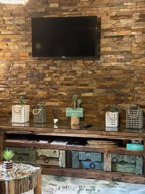 Una televisión o centro de entretenimiento en Casa Apartamento Rural U Penafrol