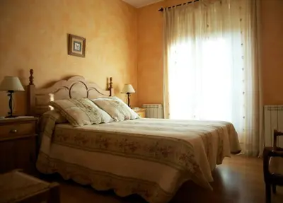 Cama o camas de una habitación en EL MESÓN DE GREDOS