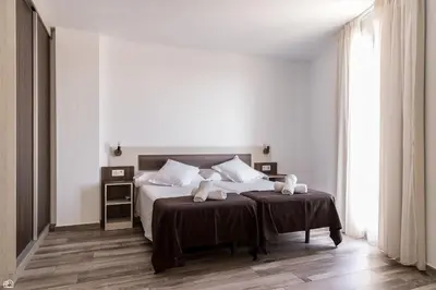 Cama o camas de una habitación en Mesón Hostal La Cabaña