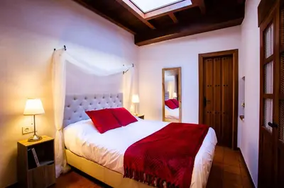 Cama o camas de una habitación en Apartamentos Puente de la Judería