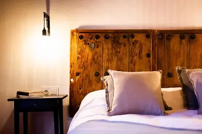 Cama o camas de una habitación en Apartamentos Puente de la Judería