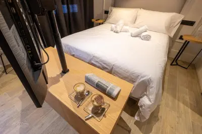 Cama o camas de una habitación en Barbarossa Suites Plaza de España