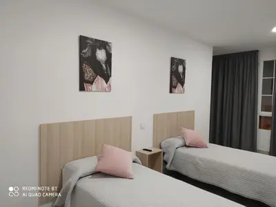 Cama o camas de una habitación en hostal la taurina