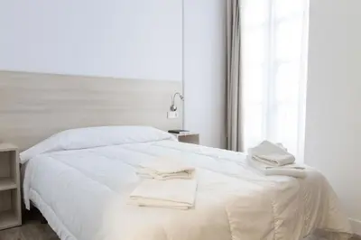 Cama o camas de una habitación en Hostel Casa Vargas Figueroa