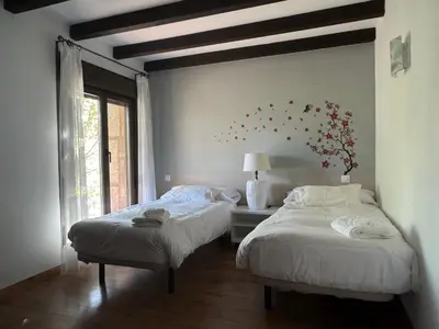 Cama o camas de una habitación en El Roble, casitas rurales