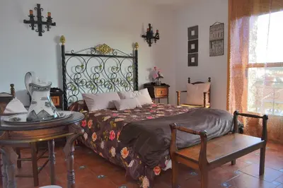 Cama o camas de una habitación en POSADA EL ARRIERO