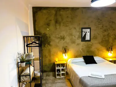 Cama o camas de una habitación en Apartamento independiente con parking privado gratuito y terraza de ensueño junto al Teatro Romano
