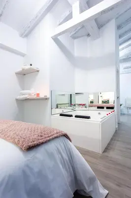 Cama o camas de una habitación en Apartamentos Hervás Suites