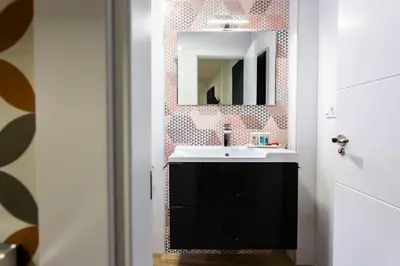 Un baño de Apartamentos Hervás Suites