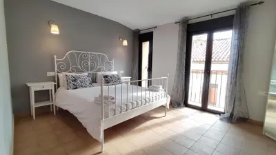Cama o camas de una habitación en Apartamentos Turísticos ENCANTO