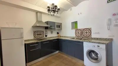 Una cocina o zona de cocina en Apartamentos Turísticos ENCANTO