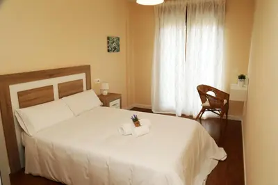 Cama o camas de una habitación en Apartamento Turistico Puente Romano P4 2-A