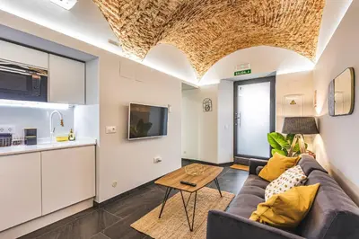 Una televisión o centro de entretenimiento en Apartamentos Cáceres Central Suites