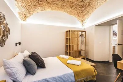 Cama o camas de una habitación en Apartamentos Cáceres Central Suites