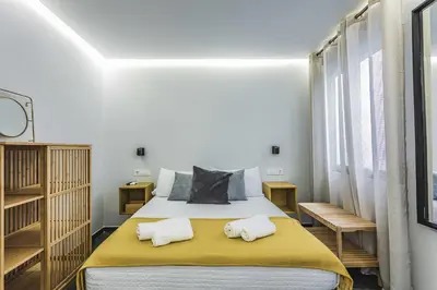 Cama o camas de una habitación en Apartamentos Cáceres Central Suites