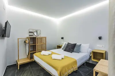 Cama o camas de una habitación en Apartamentos Cáceres Central Suites