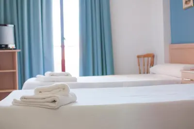 Cama o camas de una habitación en Hostal Concepción