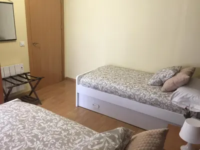 Cama o camas de una habitación en Apartamentos Turísticos Clavero 2