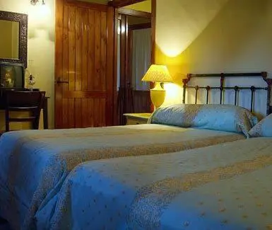 Cama o camas de una habitación en Apartamentos Rurales La Macera ****