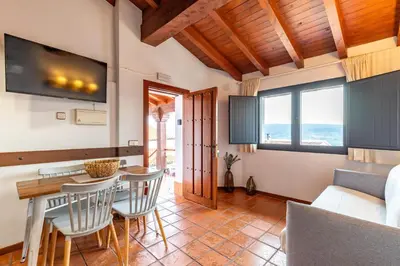 Una televisión o centro de entretenimiento en Natural&Mente Apartamentos Valle del Jerte