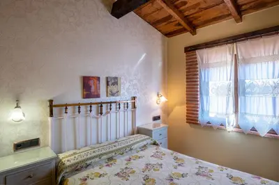 Cama o camas de una habitación en Casa Rural El Olivo / El Almendro