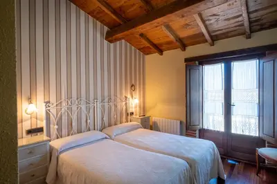Cama o camas de una habitación en Casa Rural El Olivo / El Almendro