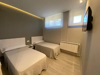 Cama o camas de una habitación en MIRASIERRA