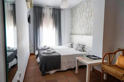 Cama o camas de una habitación en Hostal Plaza de Italia