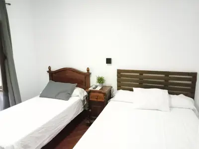 Cama o camas de una habitación en Hostal Cuzco