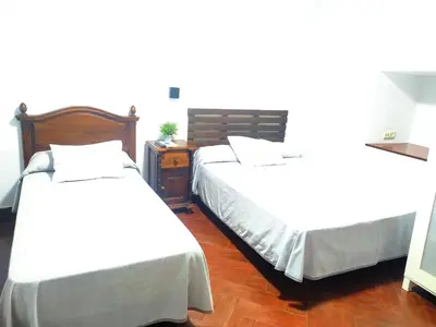 Cama o camas de una habitación en Hostal Cuzco