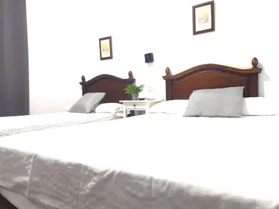 Cama o camas de una habitación en Hostal Cuzco