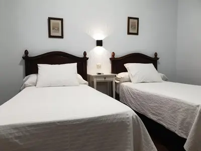 Cama o camas de una habitación en Hostal Cuzco