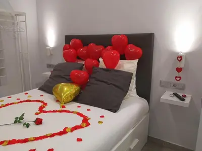 Cama o camas de una habitación en ERES EMÉRITA 