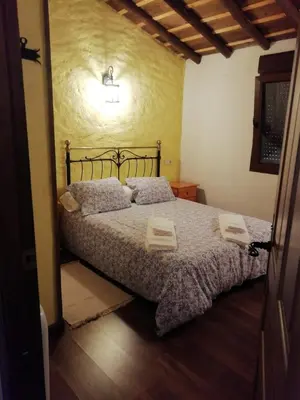 Cama o camas de una habitación en EL MOLINO