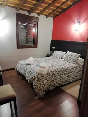 Cama o camas de una habitación en EL MOLINO