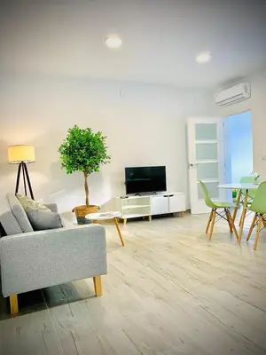 Una televisión o centro de entretenimiento en Apartamentos Villas Romanas