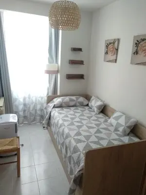 Cama o camas de una habitación en Los pisitos de El Barraco 1
